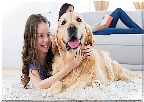 Girl hugging a dog